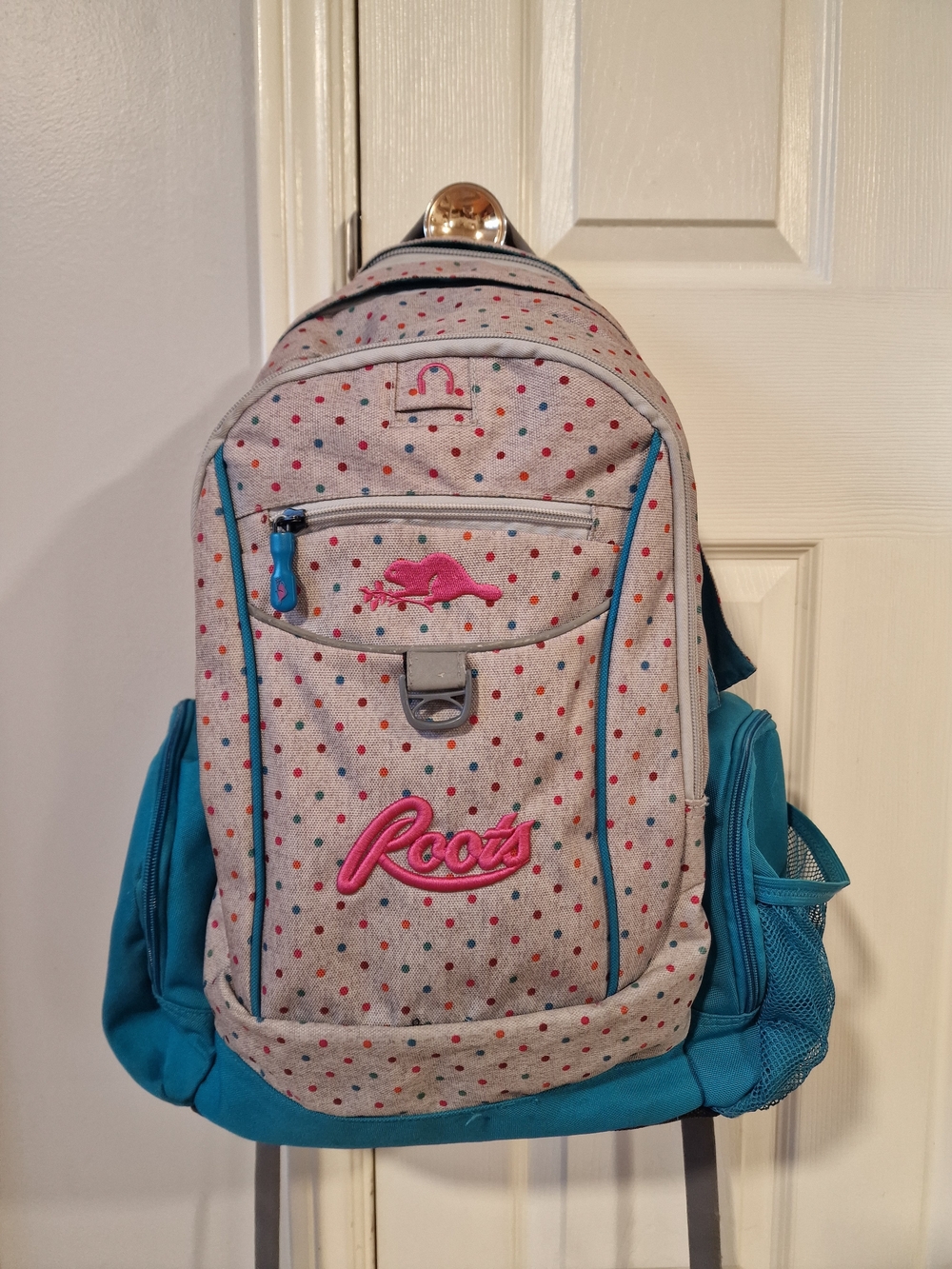 Roots Polka Dot Pink Logo Backpack in Teal Accents